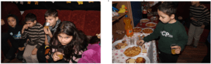 A cat laying on the ground and a table with food