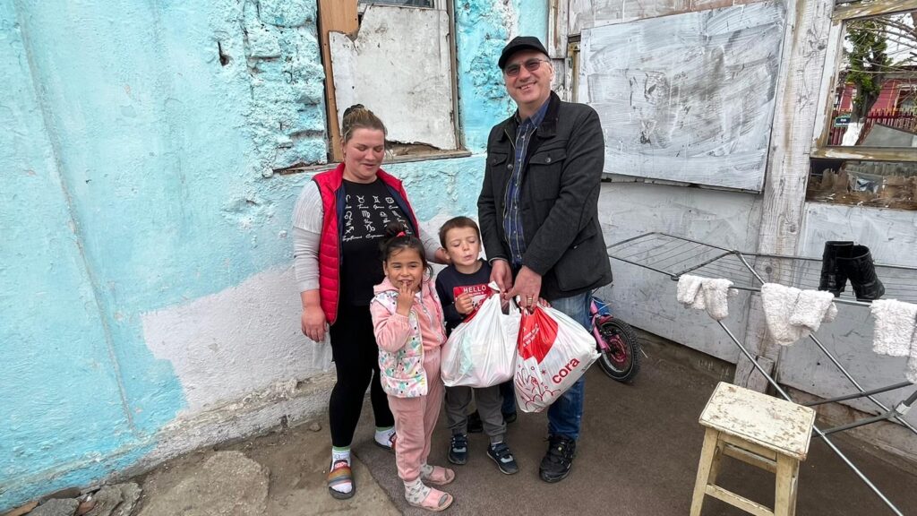 A family standing in front of a building.