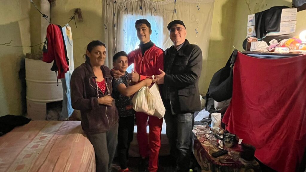 A group of people standing in a room.