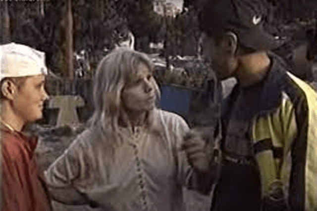 A woman and man talking to each other.