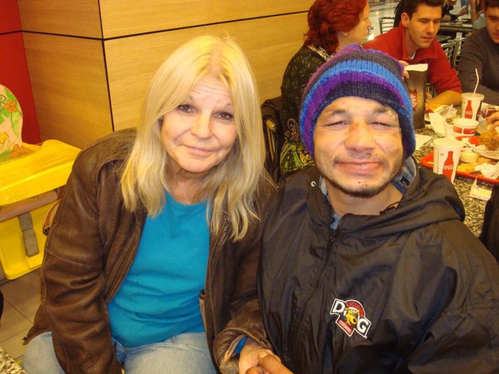 A man and woman sitting next to each other.
